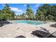 Community pool with tanning ledges, ample deck space and sun loungers at 2919 Grand Kemerton Pl, Tampa, FL 33618