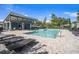 Community pool and gathering space with ample lounging and covered seating at 2919 Grand Kemerton Pl, Tampa, FL 33618