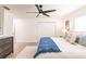 Bright bedroom featuring stylish decor, light wood floors, and a modern ceiling fan at 3316 Port Charlotte Blvd, Port Charlotte, FL 33952