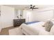 Bright bedroom featuring stylish decor, light wood floors, and a modern ceiling fan at 3316 Port Charlotte Blvd, Port Charlotte, FL 33952