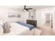 Bright bedroom featuring stylish decor, light wood floors, and a modern ceiling fan at 3316 Port Charlotte Blvd, Port Charlotte, FL 33952