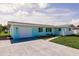 Charming single-story home featuring a well-manicured lawn and an attached one car garage at 3316 Port Charlotte Blvd, Port Charlotte, FL 33952