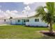 Charming single-story home featuring a well-manicured lawn and an attached one car garage at 3316 Port Charlotte Blvd, Port Charlotte, FL 33952