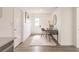 Inviting hallway featuring a workstation with a desk, chair, and neutral decor at 3316 Port Charlotte Blvd, Port Charlotte, FL 33952