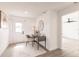 Hallway with a workstation including desk, chair, modern decor, and a view of the front door at 3316 Port Charlotte Blvd, Port Charlotte, FL 33952
