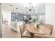 Open-concept home featuring modern decor and a seamless flow between the kitchen, dining, and living areas at 3316 Port Charlotte Blvd, Port Charlotte, FL 33952
