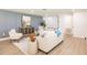 A modern living room featuring stylish furnishings, hardwood floors, and bright, neutral walls at 3316 Port Charlotte Blvd, Port Charlotte, FL 33952