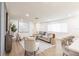 A modern living room featuring stylish furnishings, hardwood floors, and bright, neutral walls at 3316 Port Charlotte Blvd, Port Charlotte, FL 33952