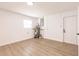 This room is home to the water heater and electrical panel on top of sleek wood floors and bright, neutral walls at 3316 Port Charlotte Blvd, Port Charlotte, FL 33952