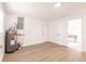 The space features wood floors, bright walls, two doors, and a water heater/electrical panel at 3316 Port Charlotte Blvd, Port Charlotte, FL 33952