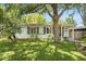 Charming single-story home with a lush front lawn and mature trees offering ample shade at 3709 W San Pedro St, Tampa, FL 33629