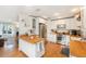 Bright kitchen with white cabinets, butcher block countertops, and stainless steel appliances at 3709 W San Pedro St, Tampa, FL 33629
