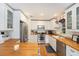 Well-lit kitchen featuring stainless steel appliances, butcher block countertops, and subway tile backsplash at 3709 W San Pedro St, Tampa, FL 33629