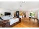 Open-concept living area with hardwood floors connecting the living, dining, and kitchen spaces at 3709 W San Pedro St, Tampa, FL 33629