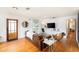 Comfortable living room featuring hardwood floors, a leather sofa, and ample natural light at 3709 W San Pedro St, Tampa, FL 33629