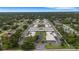 Expansive community layout featuring organized residential blocks complemented by lush greenery and a central pond at 4160 Fruitville Rd # 77, Sarasota, FL 34232