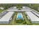 Bird's-eye view of a community pool amidst residential buildings and meticulously kept lawns and landscaping at 4160 Fruitville Rd # 77, Sarasota, FL 34232