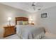 Relaxing bedroom featuring bedside tables and a ceiling fan at 4160 Fruitville Rd # 77, Sarasota, FL 34232