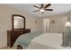 Comfortable bedroom featuring a dresser and a ceiling fan for a relaxing space at 4160 Fruitville Rd # 77, Sarasota, FL 34232