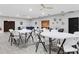 Community center featuring white tables, folding chairs, ceiling fans, and neutral decor at 4160 Fruitville Rd # 77, Sarasota, FL 34232