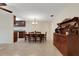 Dining room featuring a hutch and wooden table with 6 chairs, open to the kitchen at 4160 Fruitville Rd # 77, Sarasota, FL 34232