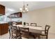 Dining room featuring a wooden table with 6 chairs, open to the kitchen at 4160 Fruitville Rd # 77, Sarasota, FL 34232