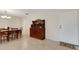 Dining room with tan tile flooring features a vintage hutch and dining table with 6 chairs at 4160 Fruitville Rd # 77, Sarasota, FL 34232