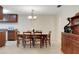 Dining room featuring a hutch and wooden table with 6 chairs, open to the kitchen at 4160 Fruitville Rd # 77, Sarasota, FL 34232
