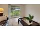 Living room featuring a large sliding glass door with a view of the outdoors at 4160 Fruitville Rd # 77, Sarasota, FL 34232