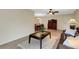 Cozy living room featuring tile flooring, a ceiling fan, and comfortable seating, creating an inviting atmosphere at 4160 Fruitville Rd # 77, Sarasota, FL 34232