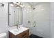 Modern bathroom with glass shower, sleek vanity, and updated fixtures at 5107 W Platt St, Tampa, FL 33609