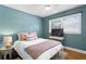 Comfortable bedroom with a ceiling fan, and bright natural light at 5107 W Platt St, Tampa, FL 33609