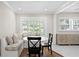 Cozy dining area with booth seating, white table, and bright natural light at 5107 W Platt St, Tampa, FL 33609