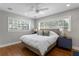 Comfortable bedroom with hardwood floors, and bright natural light at 5107 W Platt St, Tampa, FL 33609
