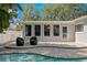 Backyard featuring a sparkling pool and patio area perfect for entertaining and relaxation at 5107 W Platt St, Tampa, FL 33609