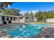 Backyard featuring a sparkling pool, landscaped yard, and patio area perfect for entertaining at 5107 W Platt St, Tampa, FL 33609