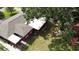 Aerial view of the house featuring a well-maintained lawn and screened-in porch at 5501 Highland S St, St Petersburg, FL 33705