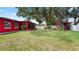 Expansive backyard with mature trees and a charming gazebo, ideal for outdoor enjoyment at 5501 Highland S St, St Petersburg, FL 33705