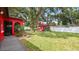 Lush backyard featuring mature trees, well-maintained lawn, and a charming gazebo at 5501 Highland S St, St Petersburg, FL 33705