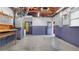 Unfinished basement with exposed beams, painted walls, and utility features at 5501 Highland S St, St Petersburg, FL 33705