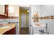 Modern bathroom with marble-tiled walls, a convenient bench, and a sleek shower at 5501 Highland S St, St Petersburg, FL 33705