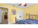Inviting bedroom with warm yellow walls, a cozy bed, and ample closet space for organized living at 5501 Highland S St, St Petersburg, FL 33705