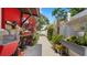 Side view of the exterior of the home with a potting station and garden walkway at 5501 Highland S St, St Petersburg, FL 33705