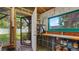 Interior view of outbuilding with storage shelves and an open door to the backyard at 5501 Highland S St, St Petersburg, FL 33705