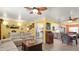 Bright and airy living room featuring laminate floors and an open layout with dining and kitchen access at 5501 Highland S St, St Petersburg, FL 33705