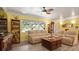 Comfortable living room featuring laminate floors, neutral sofa and ample natural light at 5501 Highland S St, St Petersburg, FL 33705