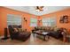Cozy living room featuring comfortable seating, natural light from multiple windows and warm, inviting color palette at 5501 Highland S St, St Petersburg, FL 33705