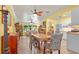 Inviting open-concept home featuring laminate flooring and an open layout with dining and kitchen access at 5501 Highland S St, St Petersburg, FL 33705