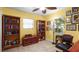 Organized home office with wooden bookshelves, a desk, and a comfortable chair for a productive workspace at 5501 Highland S St, St Petersburg, FL 33705