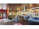 Outdoor patio features a full kitchen, a hot tub, overhead fans, brick accents and comfortable patio seating at 5501 Highland S St, St Petersburg, FL 33705